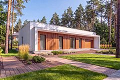 Современный одноэтажный дом с плоской крышей и гаражом