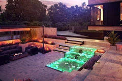 Проект современного дома с плоской кровлей и подземным гаражом.