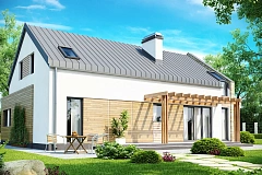 Дом с мансардой современного характера с частично встроенным гаражом.