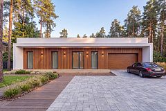 Современный одноэтажный дом с плоской крышей и гаражом