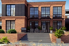 Современный двухэтажный дом с облицовкой фасада из кирпича