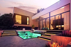 Проект современного дома с плоской кровлей и подземным гаражом.