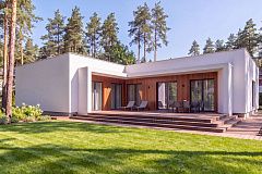 Современный одноэтажный дом с плоской крышей и гаражом