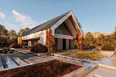 Современный дом с двускатной крышей и навесом под одно авто